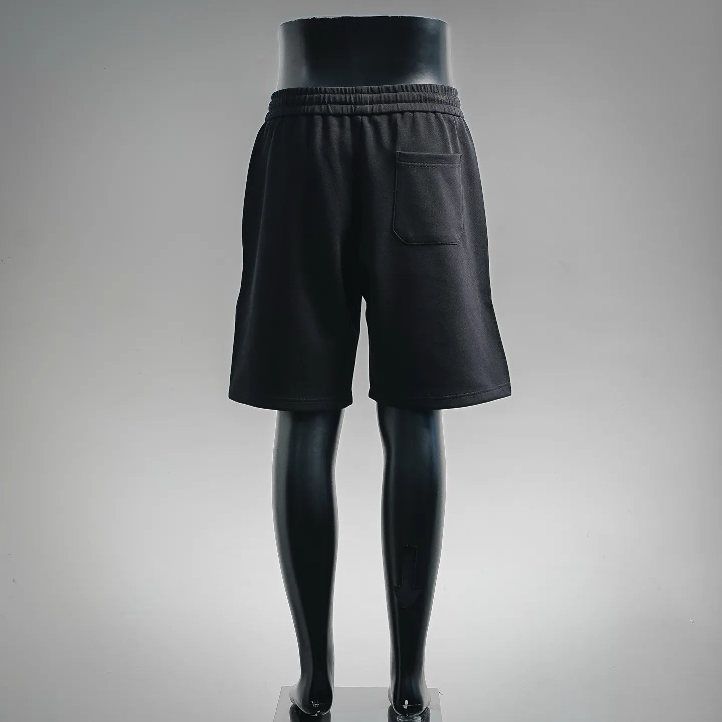 Prada black drawstring shorts, back view with patch pockets