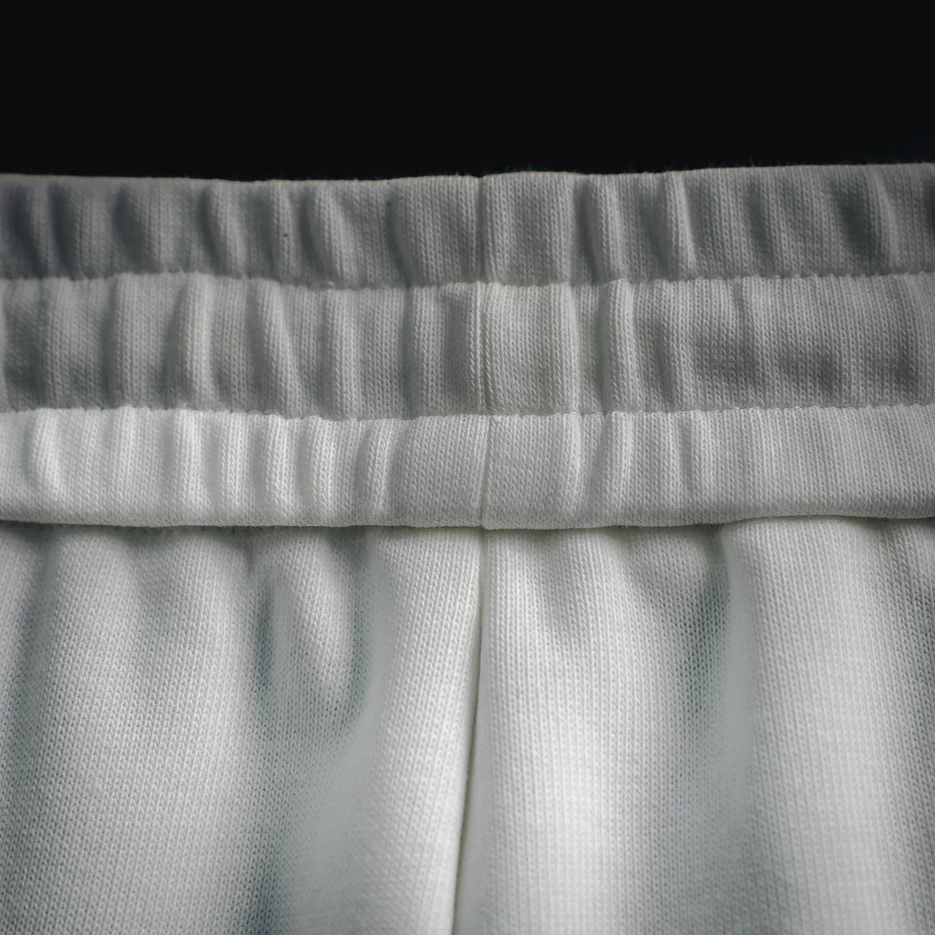 White Prada shorts elastic waistband with textured ribbing detail.