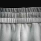 White Prada shorts elastic waistband with textured ribbing detail.