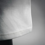 White Prada shorts hem with clean stitched edge detail.