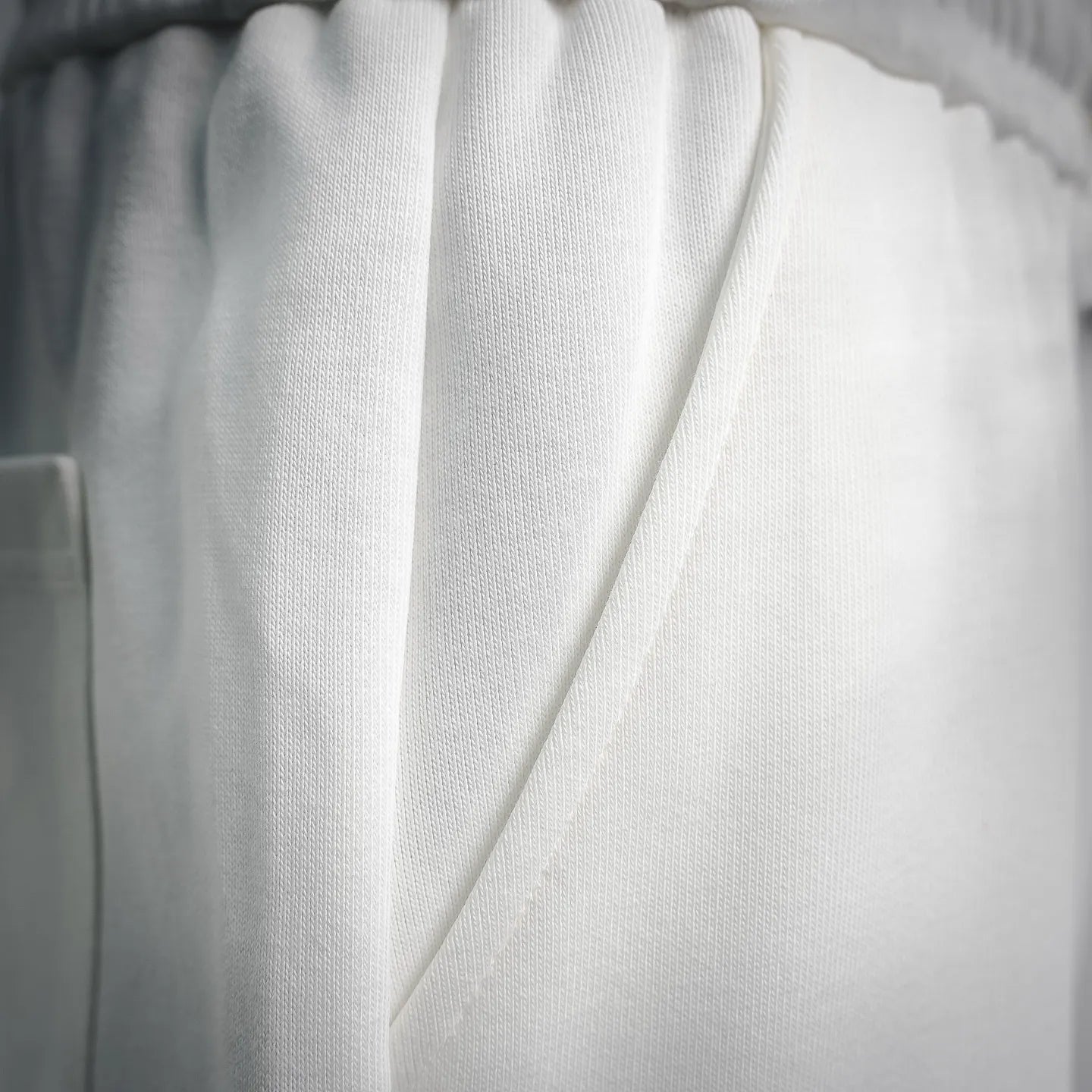 White Prada shorts with side seam and drawstring cord detail.