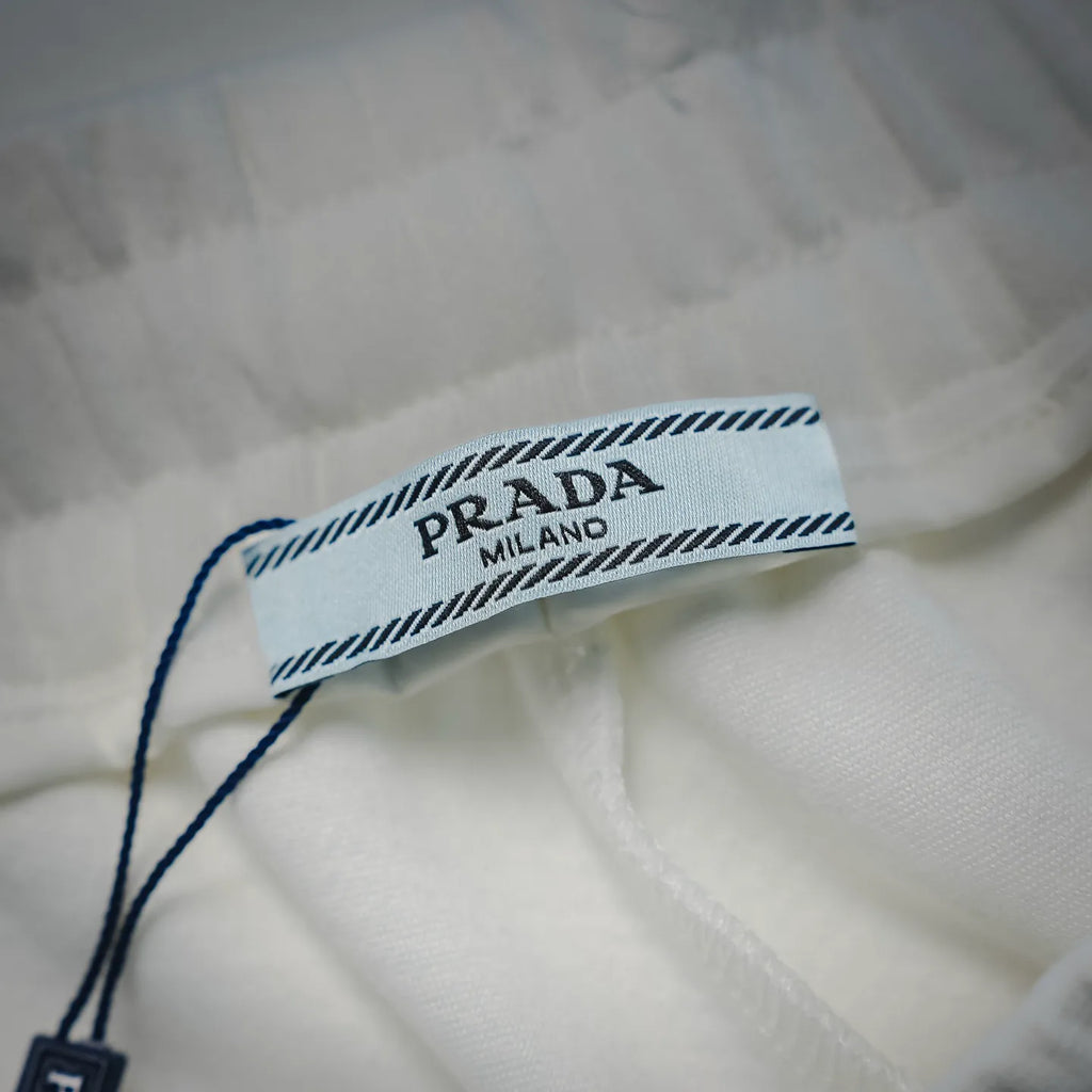White Prada shorts inner waistband label with Prada Milano branding.
