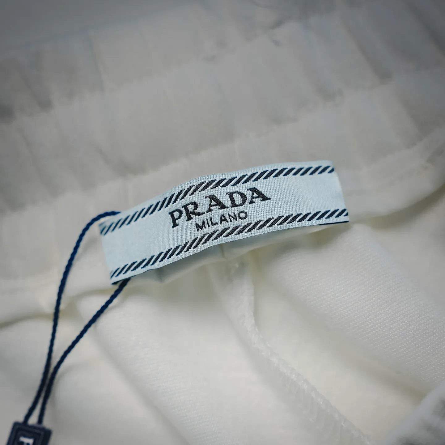 White Prada shorts inner waistband label with Prada Milano branding.