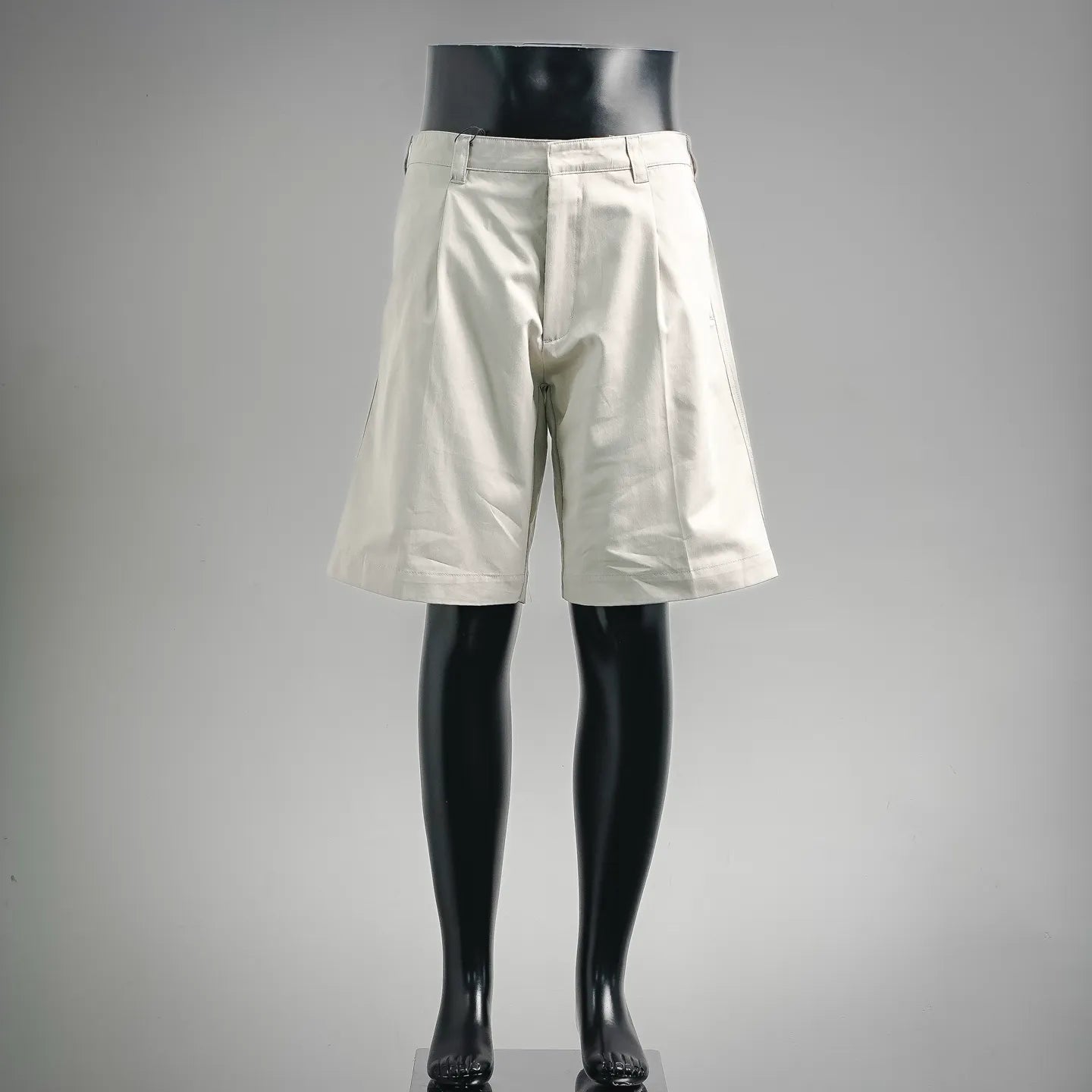 White tailored shorts with belt loops and button closure