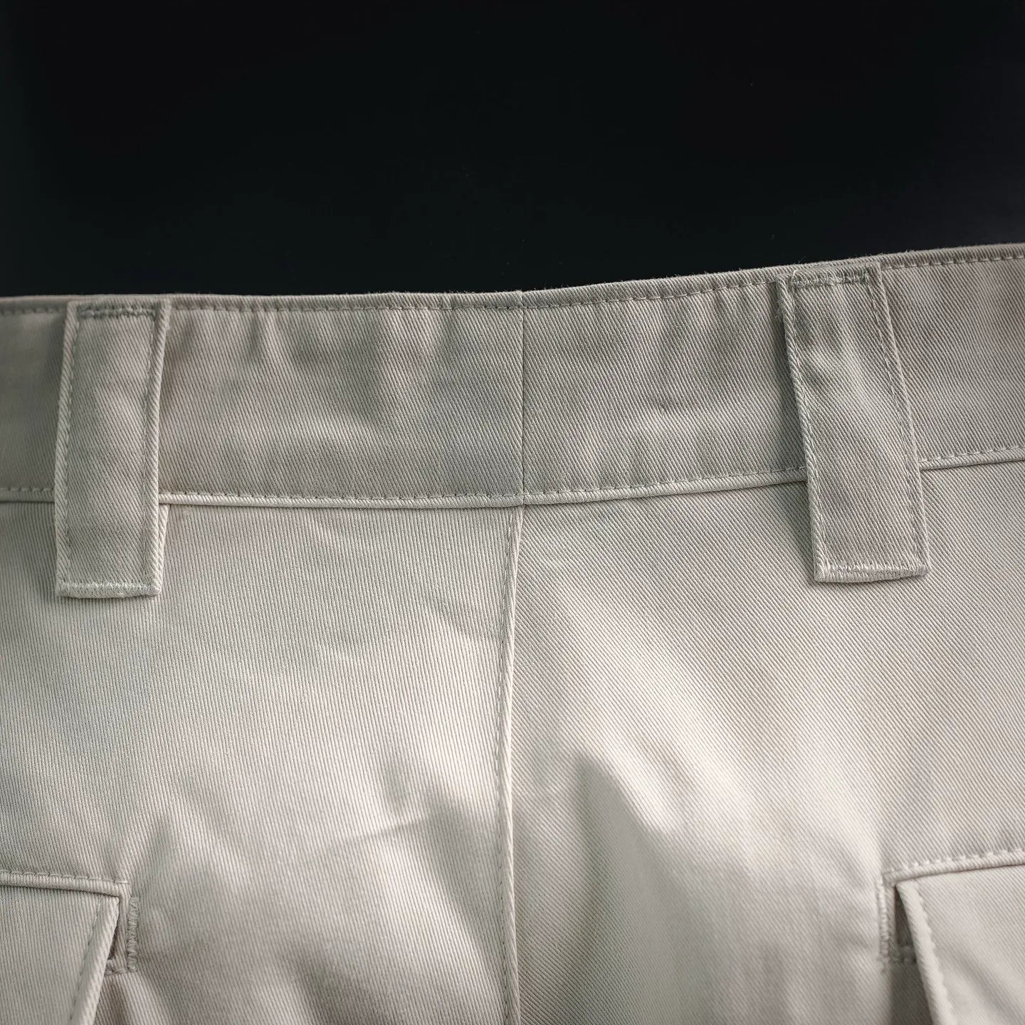 White shorts waistband with belt loops and stitched front closure