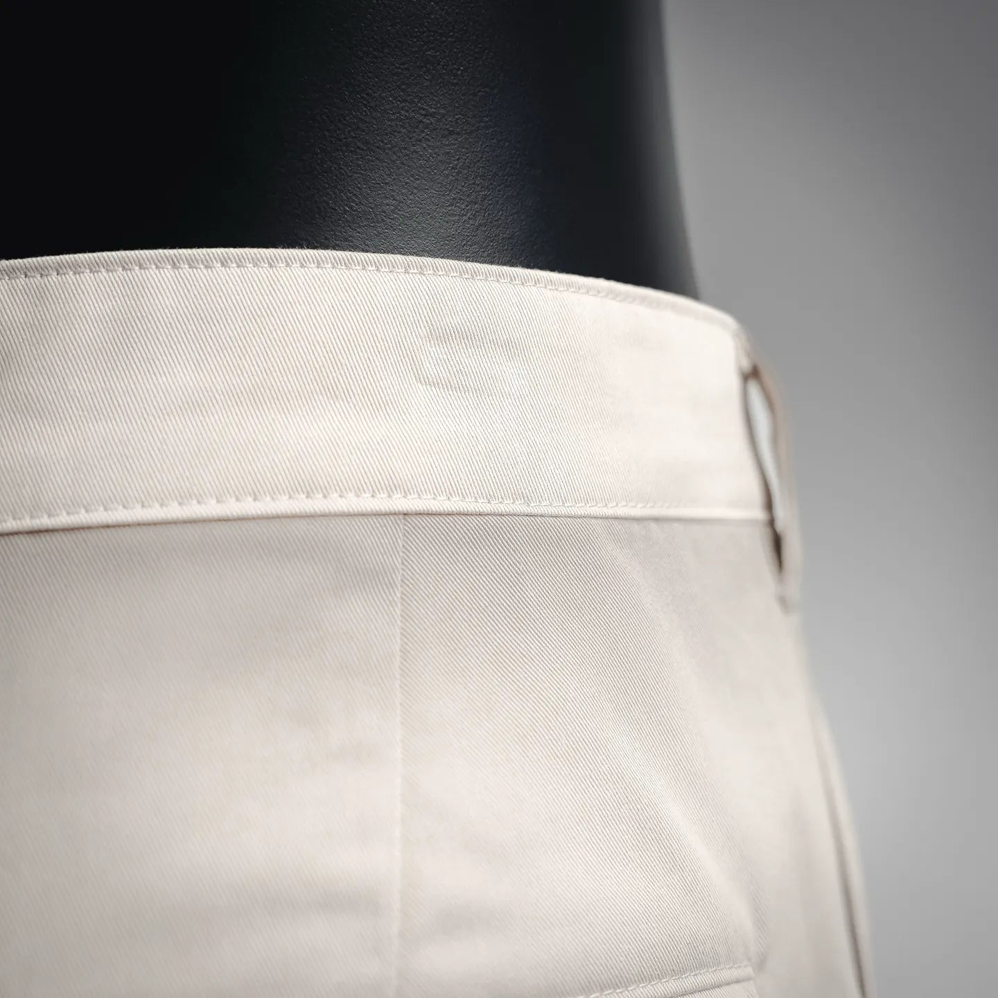 White shorts waistband with side pocket opening and stitched waistband