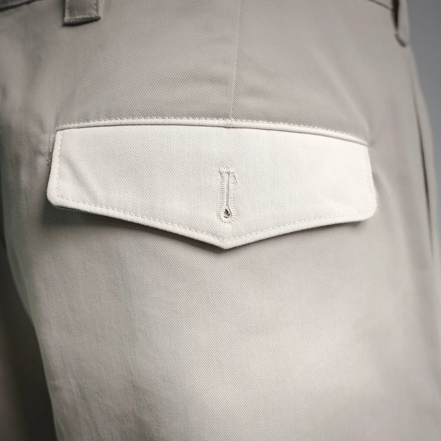 White shorts back pocket with small embroidered brand tag