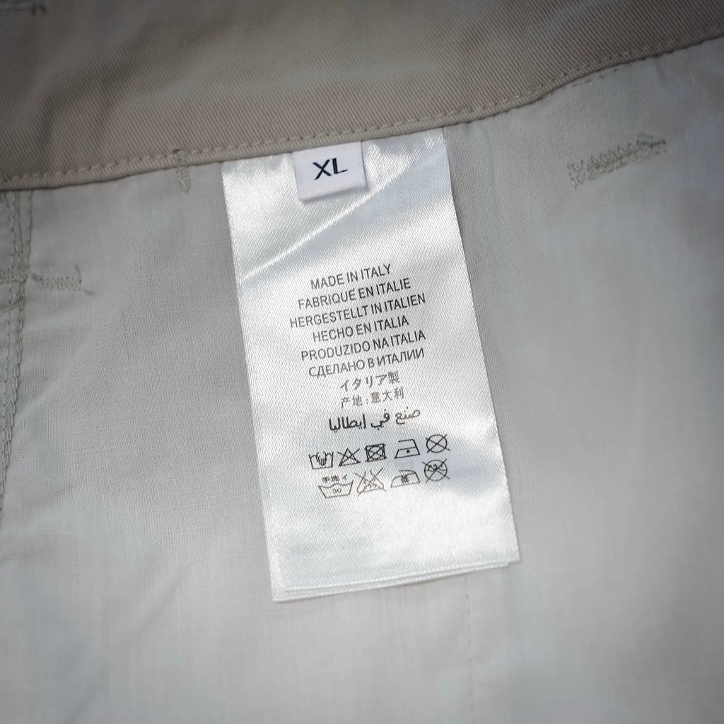 White shorts size label XL with Made in Italy care info