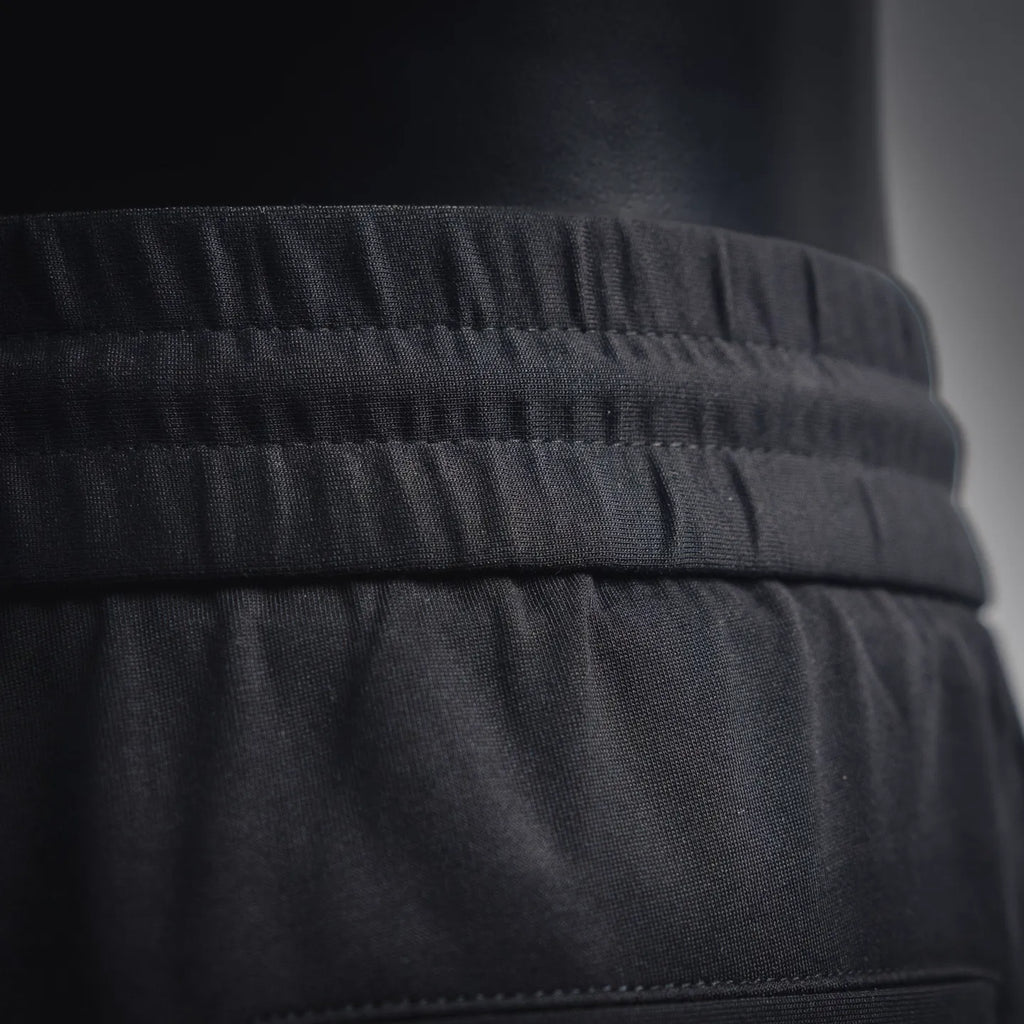 Black waistband with ribbed elastic and stitched seam
