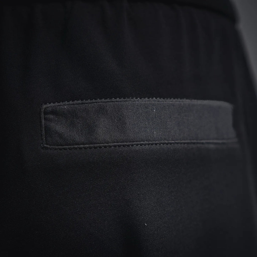 Black pocket interior with stitched rectangular fabric label