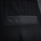 Black pocket interior with stitched rectangular fabric label