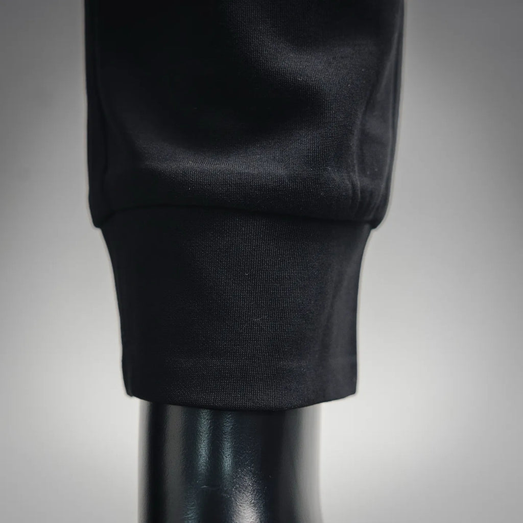 Black tapered pant leg with ribbed cuff detail