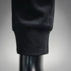 Black tapered pant leg with ribbed cuff detail