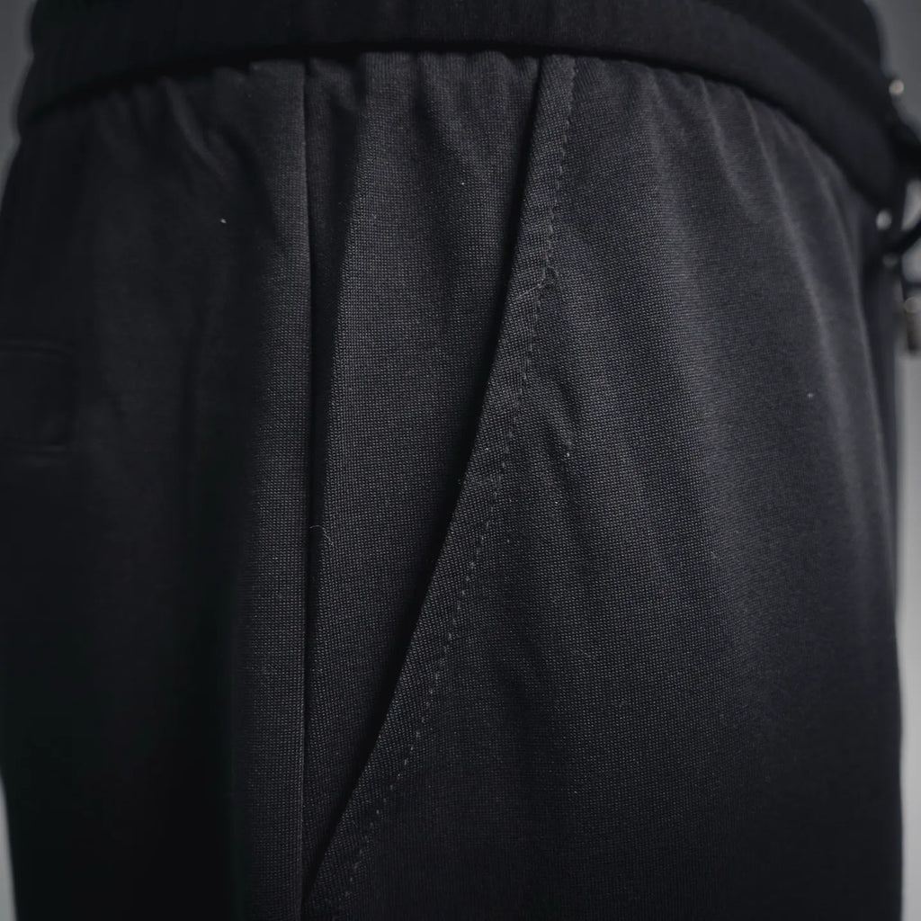 Black back panel with stitched seam and gathered waist drape