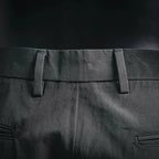 Black pant waistband with belt loops and stitched waist seam