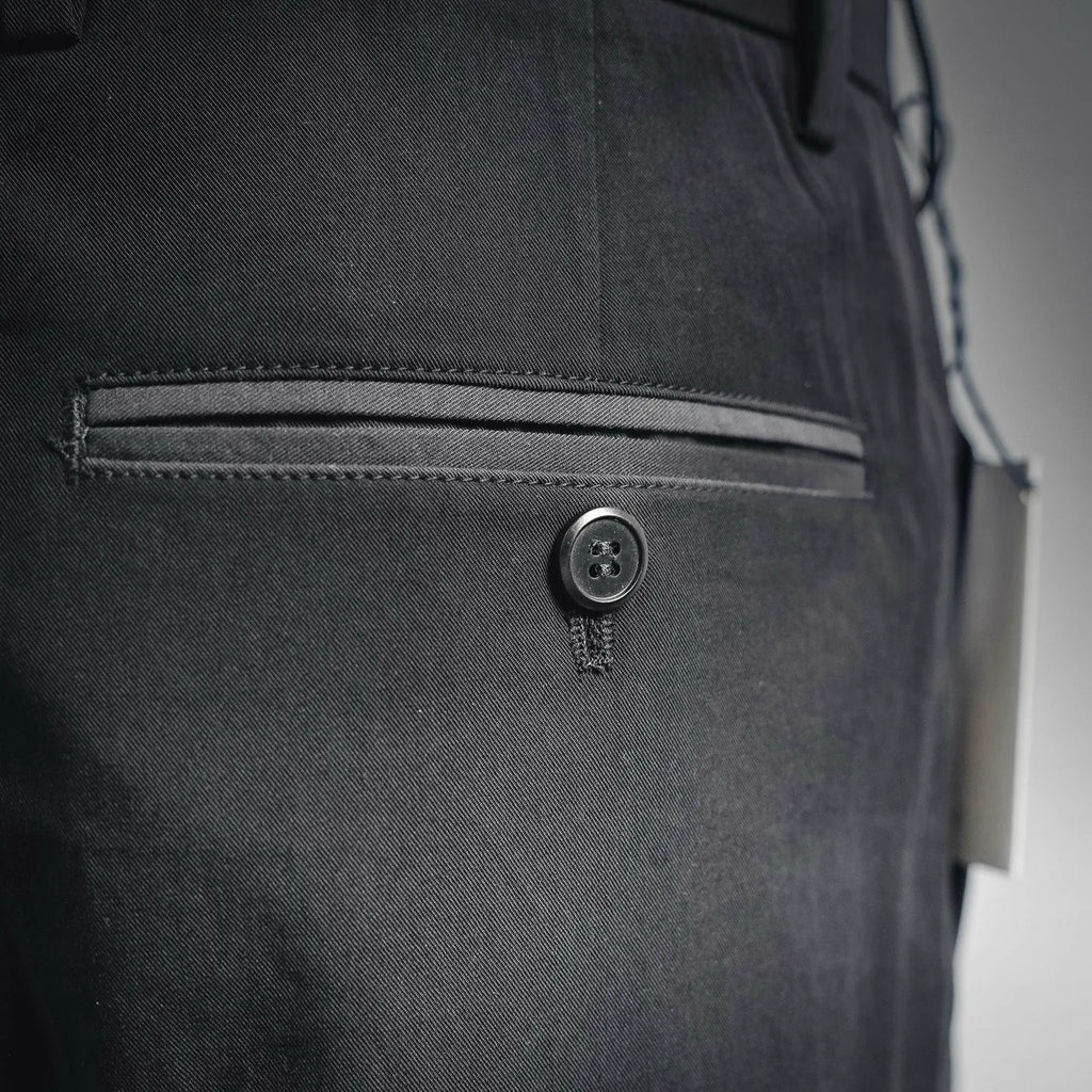 Black pant front with button closure and zipper fly