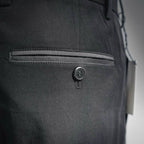 Black pant front with button closure and zipper fly