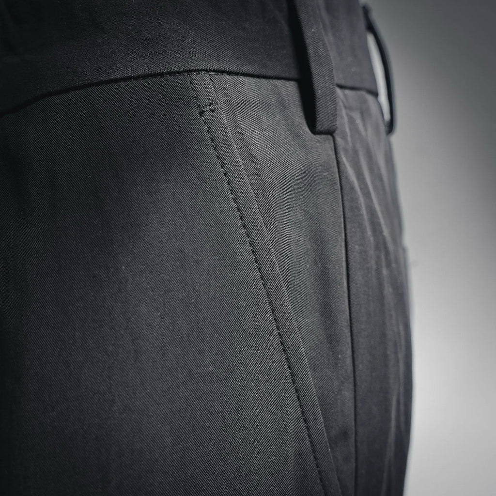 Black pant leg with side seam and stitched panel detail