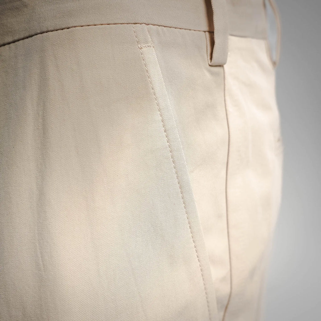 Beige Prada pants side seam and stitched waistband detail