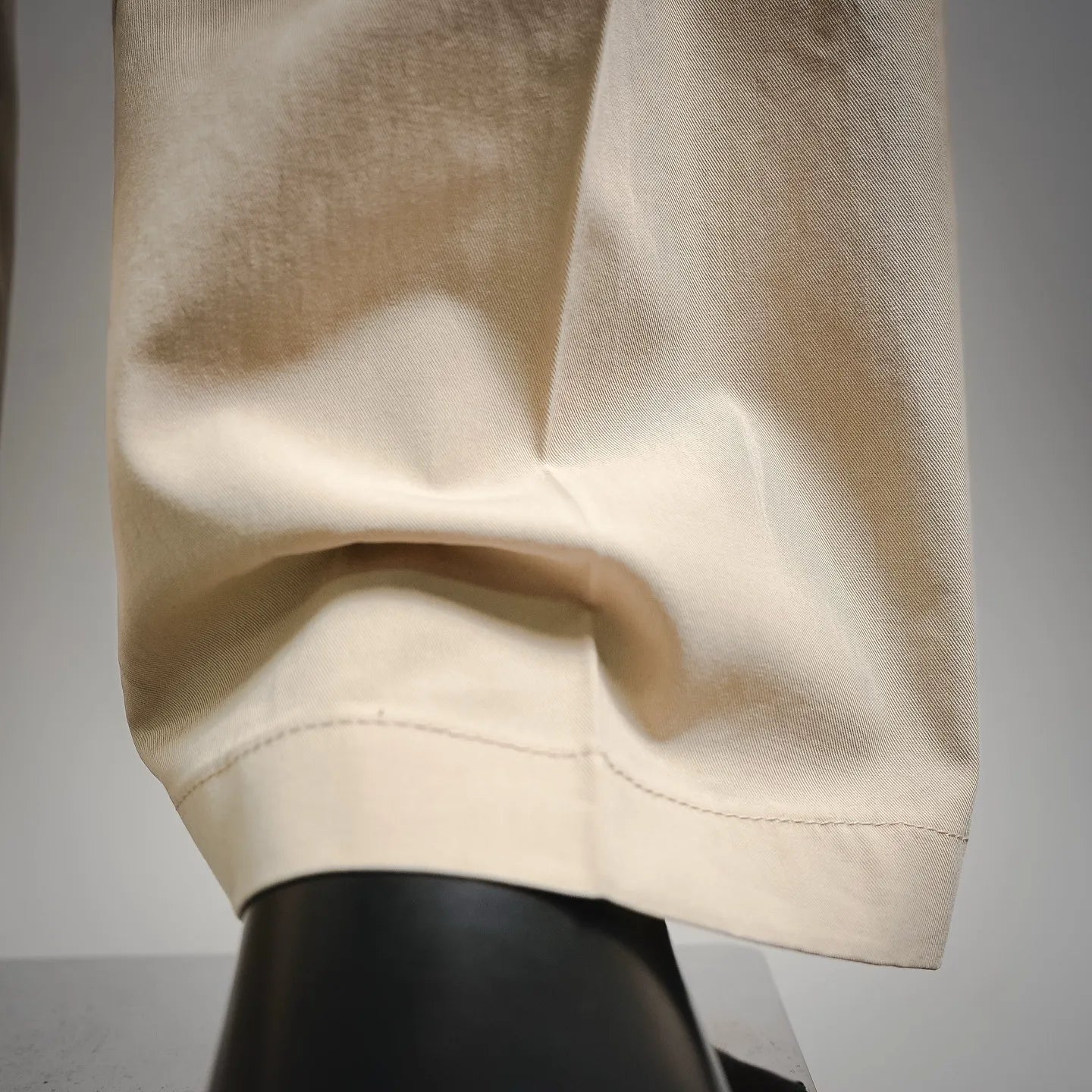Beige Prada pants hem with cuff and stitched pocket opening
