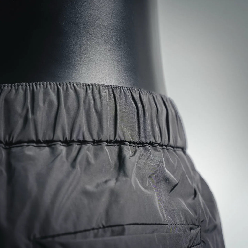 Dark nylon pants waistband and gathered front with stitched trim