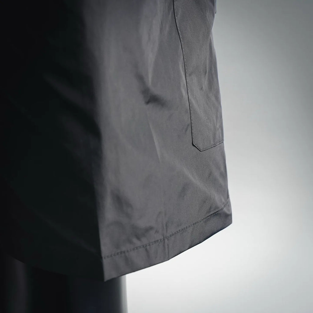 Dark nylon cargo pocket on side of shorts-style pants