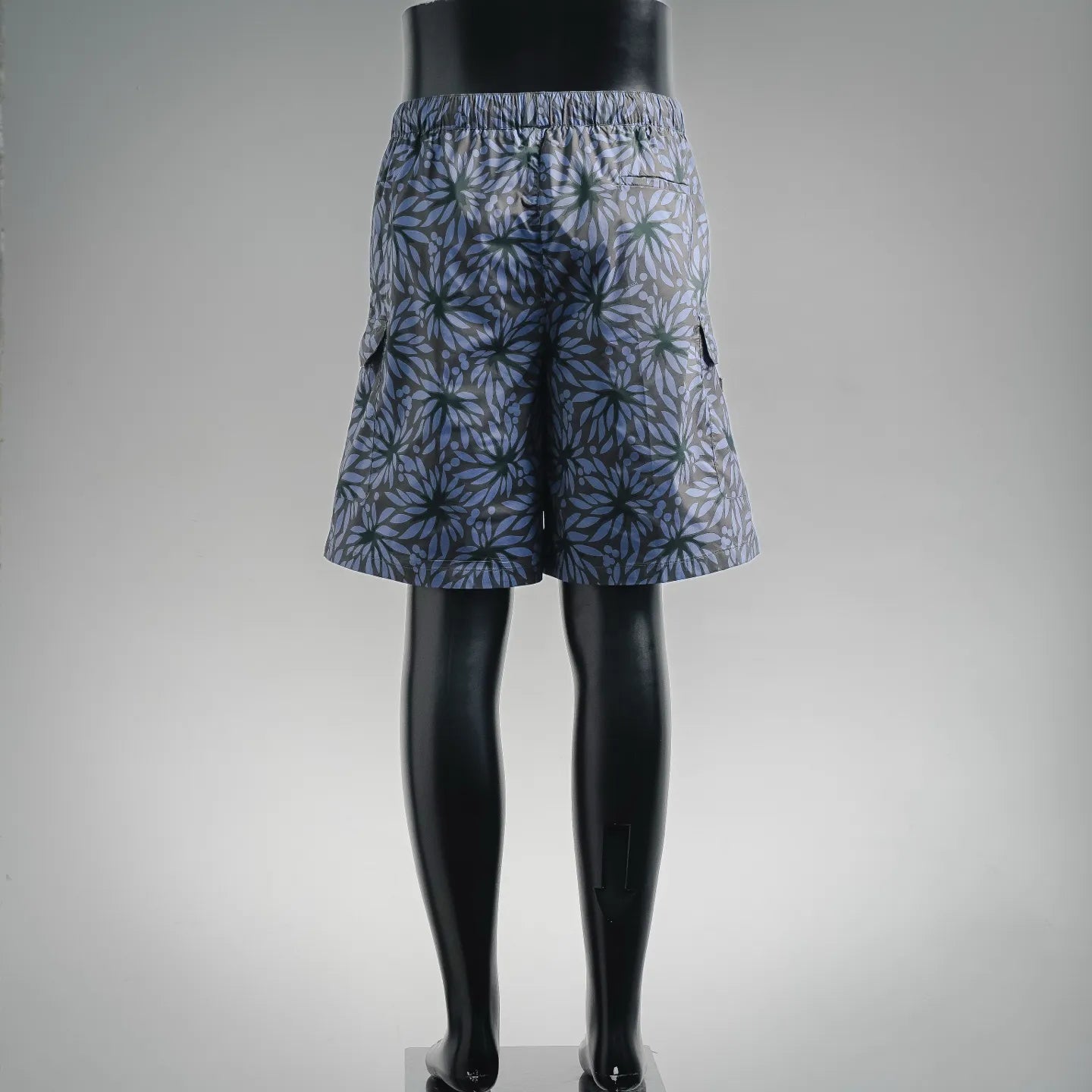 Prada blue floral print shorts with elastic waistband on mannequin, back view