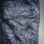 Prada blue floral print shorts front pocket with PRADA logo snap tab