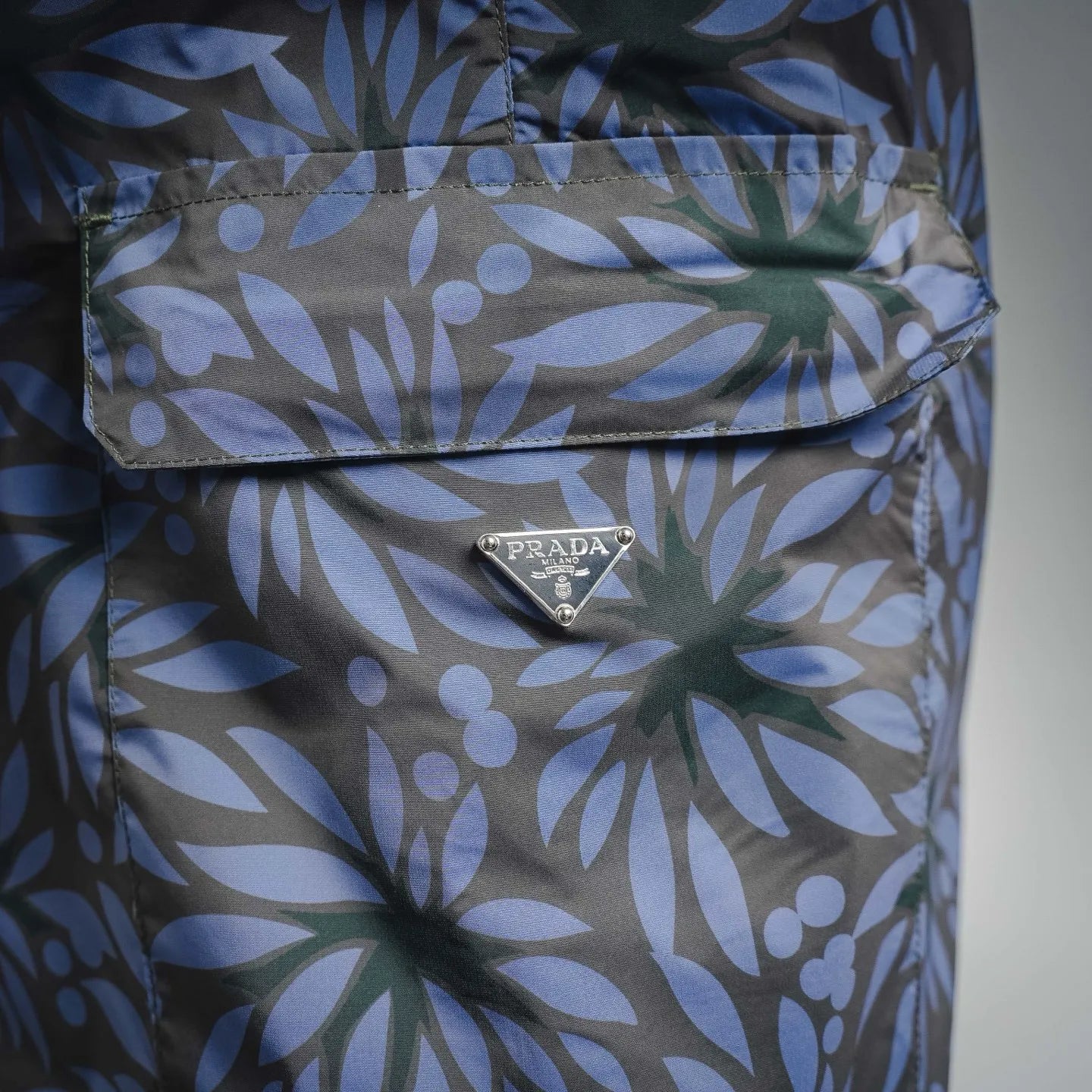 Prada blue floral print shorts front pocket with PRADA logo snap tab