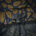 Prada size tag 52 at waistband on blue and tan floral shorts