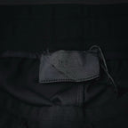 Prada black shorts inner label tag near waistband seam