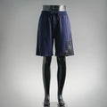 Navy drawstring shorts with elastic waistband and side logo detail