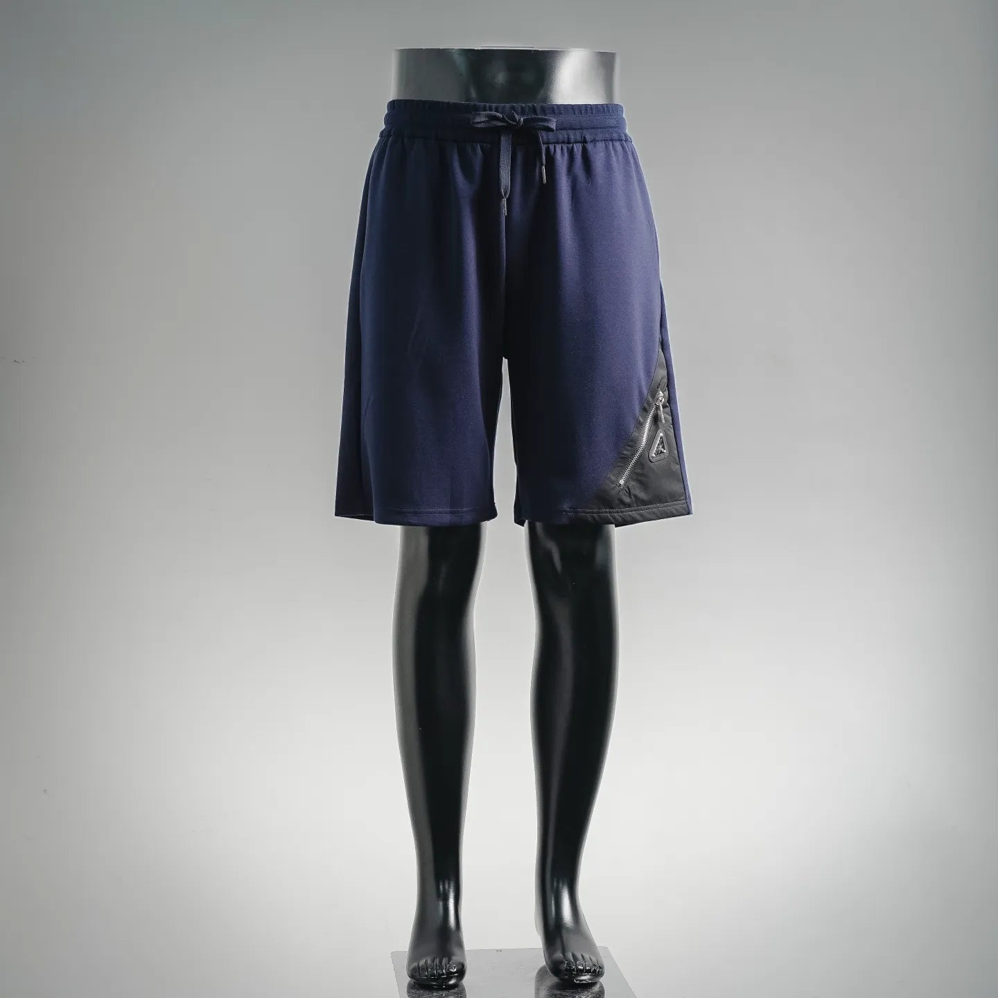 Navy drawstring shorts with elastic waistband and side logo detail