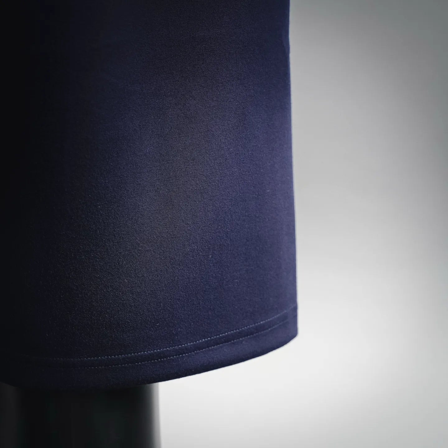 Navy shorts hem detail with smooth curved stitching