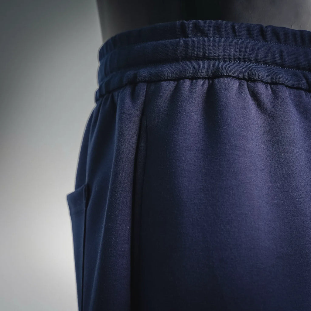 Navy elastic waistband with gathered fabric and side seam