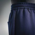 Navy elastic waistband with gathered fabric and side seam