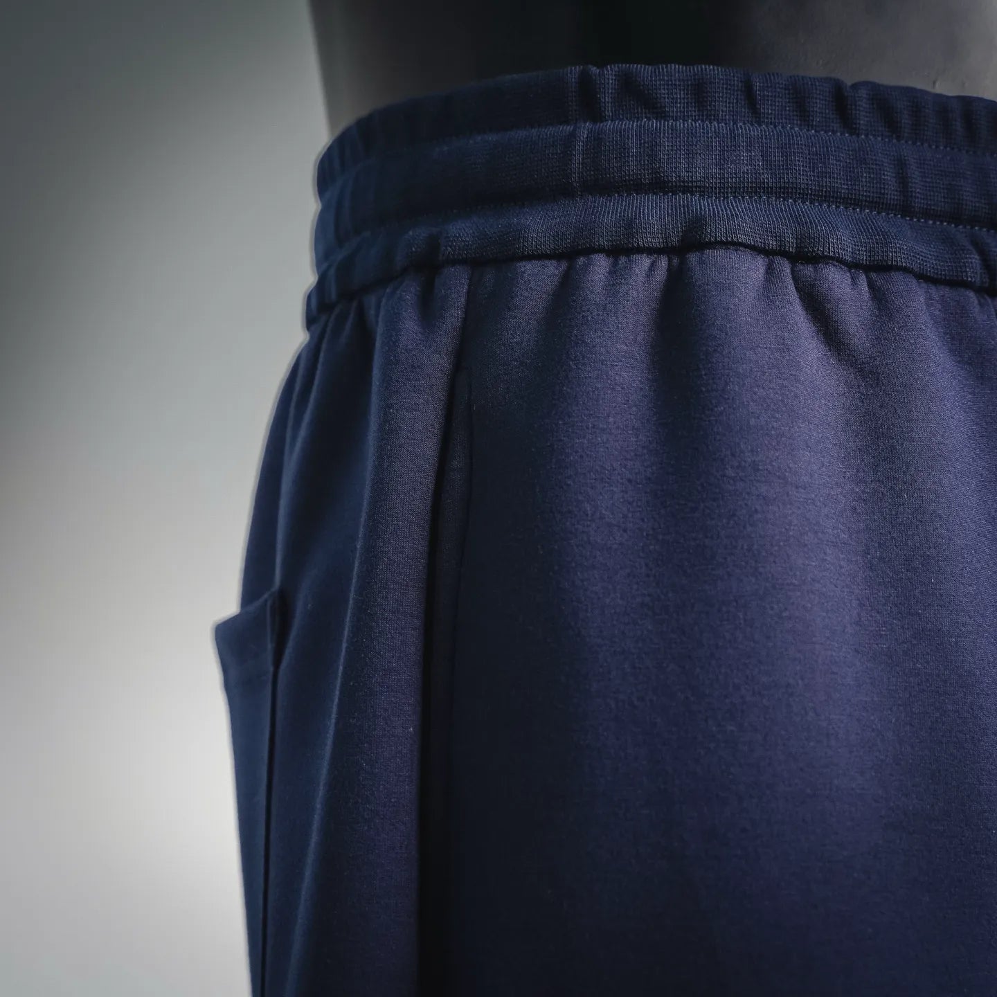 Navy elastic waistband with gathered fabric and side seam