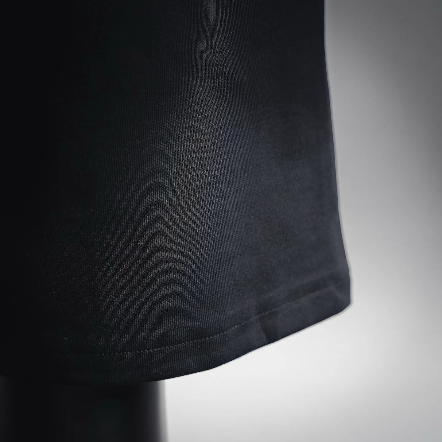Black Prada shorts hem with textured knit fabric