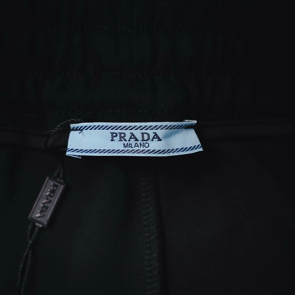Prada fabric label inside waistband on black shorts