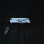 Prada fabric label inside waistband on black shorts