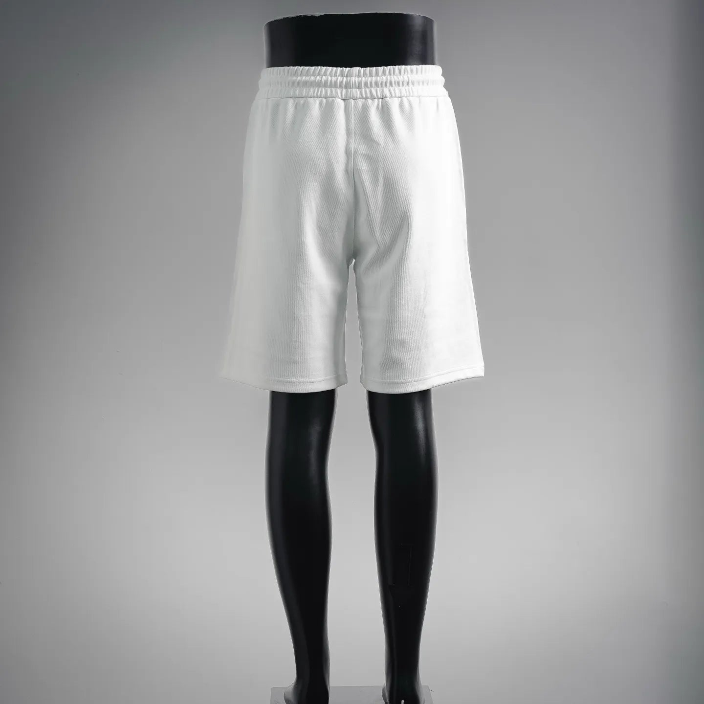White drawstring shorts with elastic waistband, clean back view