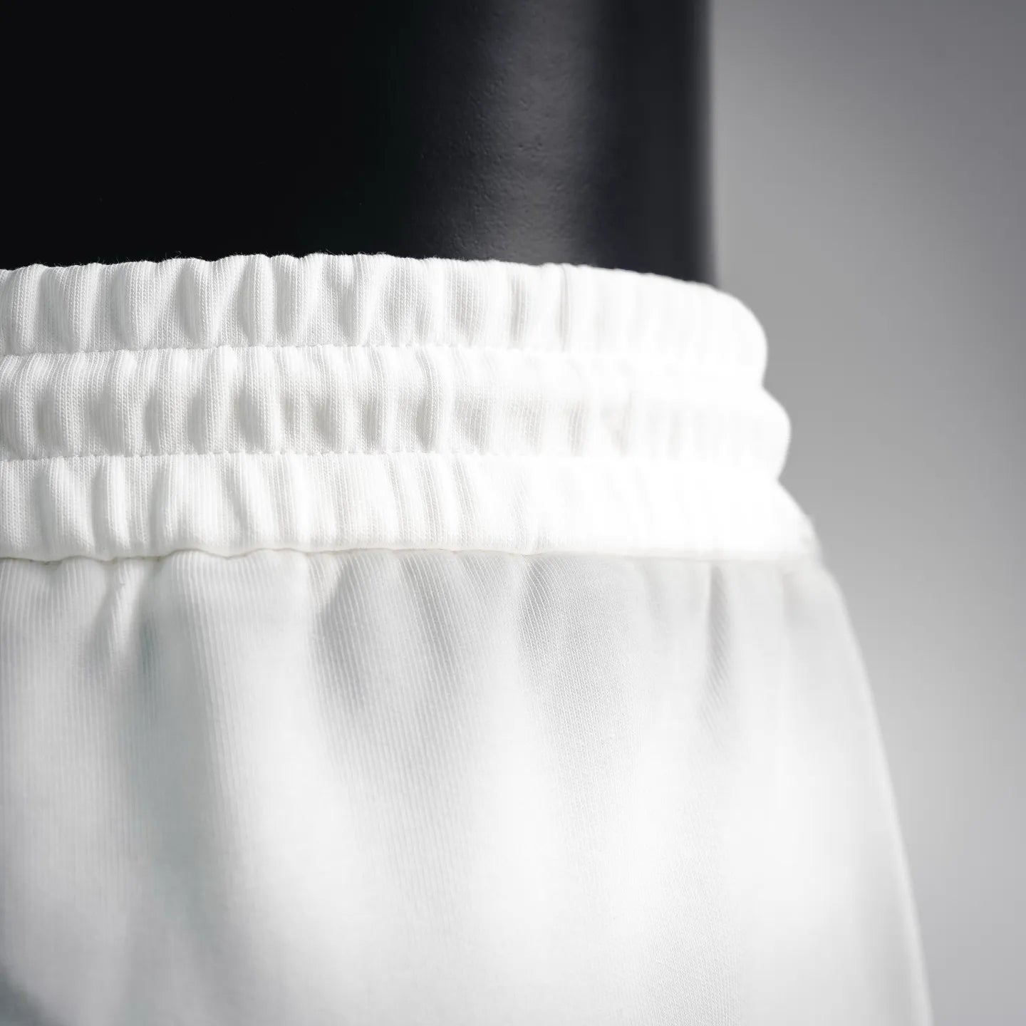 White elastic waistband with gathered texture detail