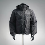 Black hooded zip-up jacket with Prada triangle logo at chest
