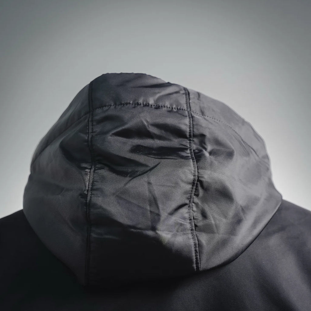 Close-up hood with stitched seams on black zip-up jacket