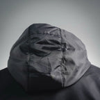 Close-up hood with stitched seams on black zip-up jacket