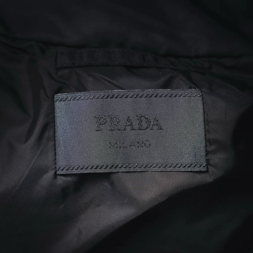Interior black jacket label with PRADA text