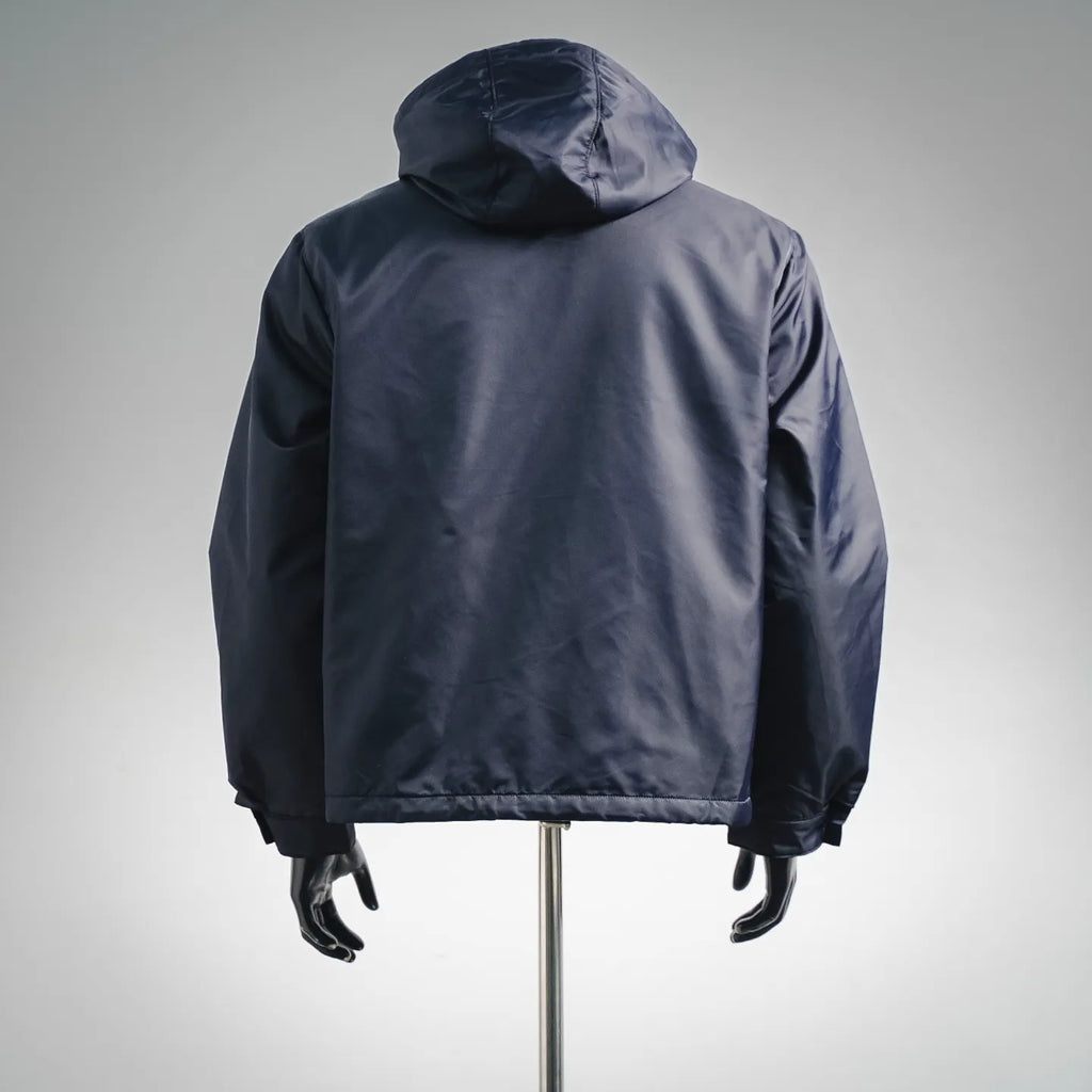 Navy hooded puffer jacket, back view with full-length zipper
