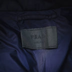 Prada fabric label on navy inner lining near collar seam