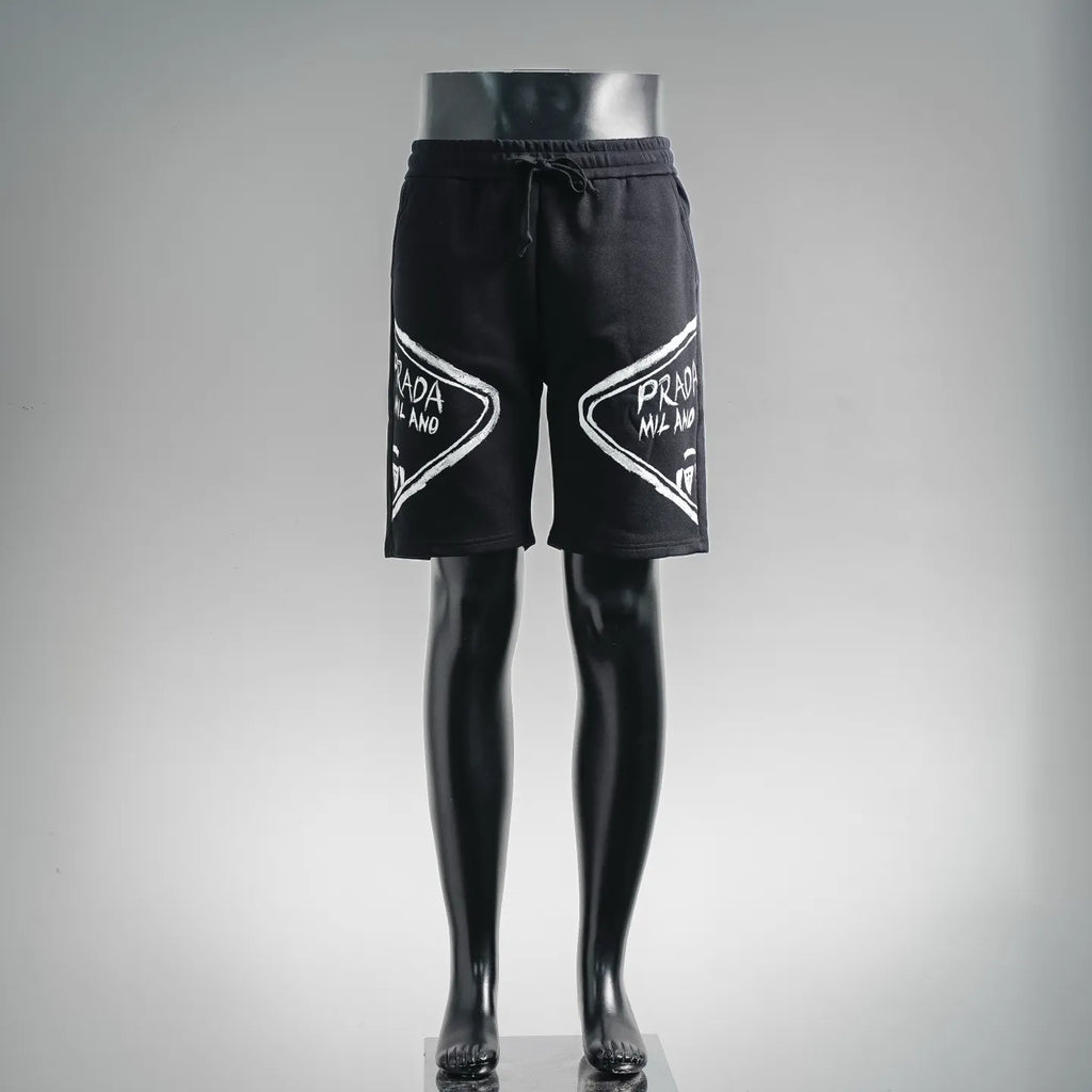 Black Prada logo shorts with elastic waistband and drawstring, front view