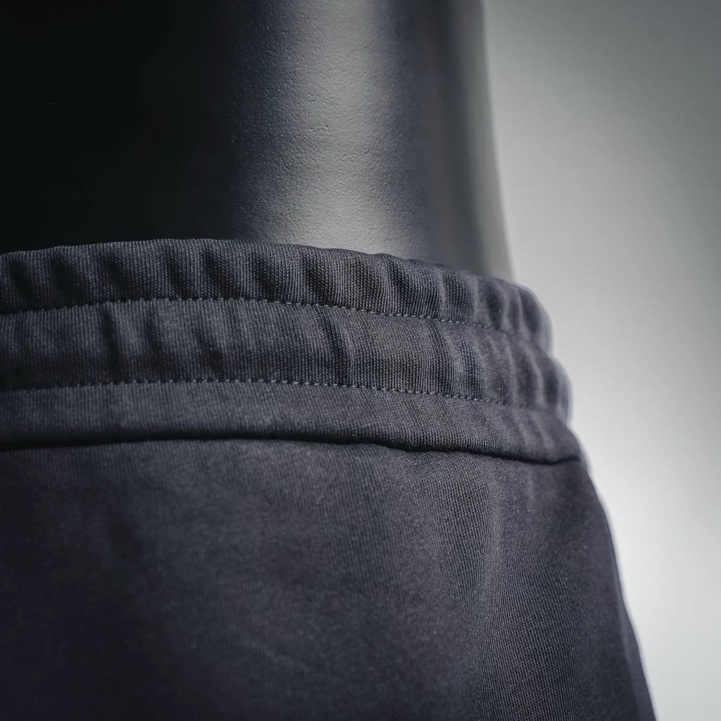 Black shorts elastic waistband with textured fabric close-up